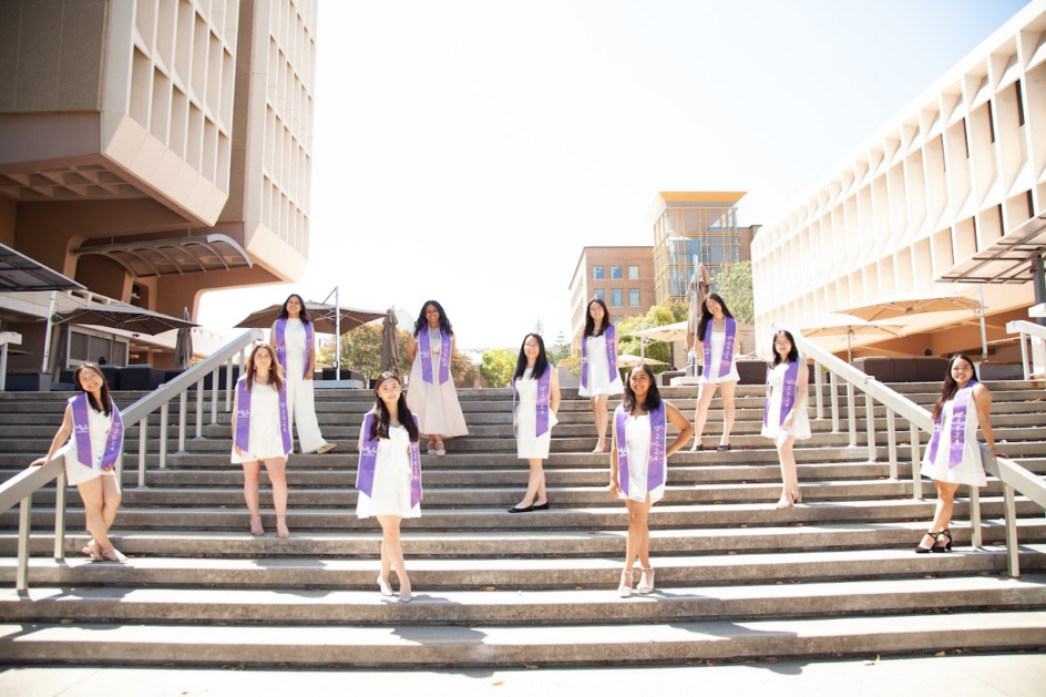 Eleven women stand on stairs at UCI, outside the computer science building