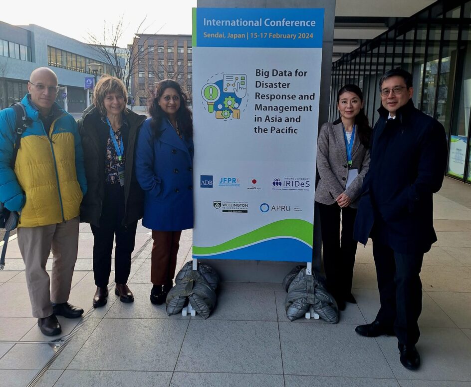 Nalini and four other researchers stand near a poster that says Bid Data for Disaster Response and Management in Asia and the Pacific